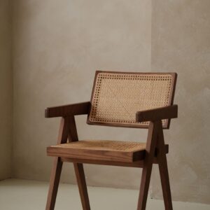 Woven timber lounge chair in a neutral interior